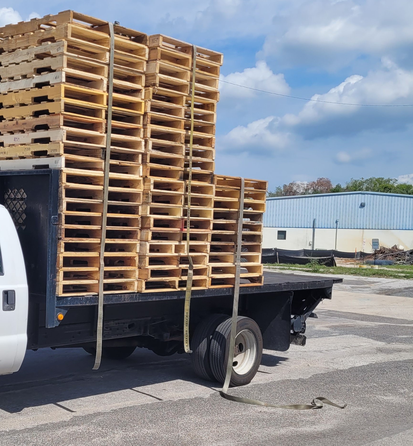 Flawless Golden Oak Grade A Pallets stacked in sunlit Central Florida distribution hub